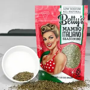 A bag of mambo italiano seasoning next to a bowl.
